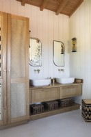 Twin sinks and mirrors in country bathroom