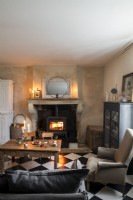 Lit wood burning stove in country living room