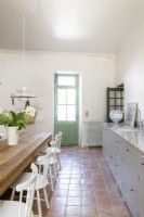 Country kitchen-diner with terracotta flooring