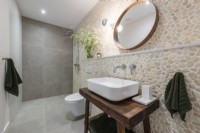 Bathroom with stone wall