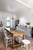 Large wooden table in modern country kitchen