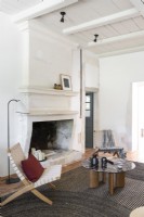 White painted living room with large fireplace