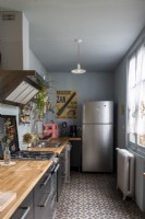 Modern grey kitchen with wooden worktops