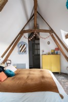 Country childrens room with vaulted ceiling