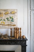 Wooden vintage bowling pins and ball on mantelpiece - detail