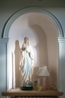 Religious sculpture in arched alcove