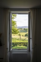 Countryside view from open windows