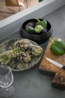 Detail of vegetables on concrete kitchen worktop