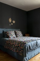 Dark grey bedroom with floral bedding 