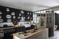 Display of white plates in wall rack of modern country kitchen