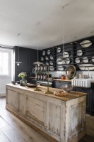 Distressed wooden island in modern country kitchen