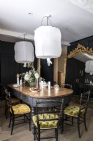 Black painted classic style dining room with gold mirror 