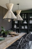 Sisal string lampshades over table in modern dining room