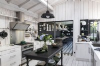 Monochrome kitchen with view to dining room