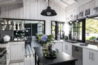 Black and white modern country kitchen with view to dining room