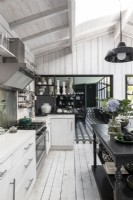 Modern country monochrome kitchen with view to dining room