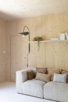 Beige sofa in wooden living room