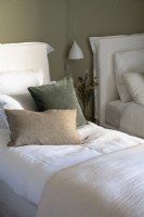 Velvet pillows on single bed - detail