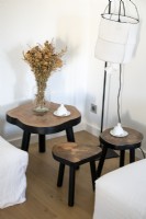 Detail of three side tables and lamp