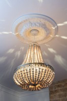 Illuminated hand made beaded chandelier