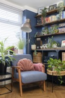 Chair and shelving in a blue living room