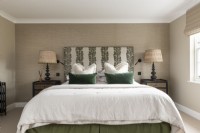 Master bedroom with upholstered headboard.