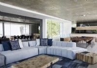 Contemporary open plan living space with large curved sofa