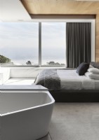 Minimal bedroom with bath and large picture windows