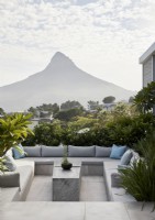 Sunken seating area in outdoor living space with mountain view
