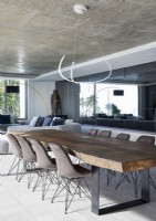 Contemporary dining room with large wooden table 