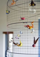 Detail of quirky birdcage lampshade