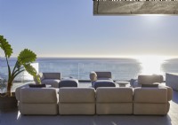 Large outdoor living area on terrace with sea views