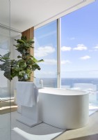 Freestanding contemporary bath with sea views 