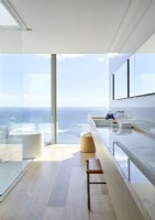 Contemporary bathroom with sea views