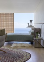 Contemporary bedroom with sea views