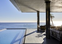 Swimming pool and sea views from contemporary outdoor living space