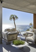 Covered outdoor living area with coastal views