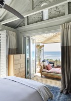 View of terrace and the sea from country style bedroom