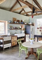 Small circular table in country kitchen-diner