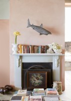 Shark sculpture above fireplace