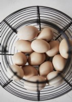 Detail of metal basket of fresh eggs