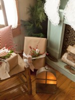 Christmas gifts and lantern details by fireplace