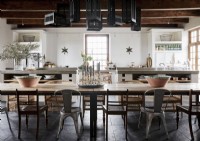 Large wooden dining table in country kitchen-diner