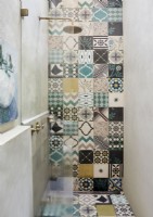 Patterned tiling in small shower cubicle