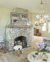 The library welcomes both rustic and modern elementsAn original Private Beach sign tie the space to its coastal heritage.