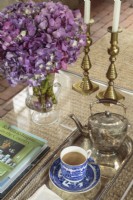 Brass candlesticks, a silver teapot and a Chinese Canton teacup are among Ellenâ€™s favorite items. 