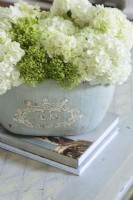 Details matter to Kathy who prefers to show off fresh cut blooms in unique containers, like in this antique French pot.