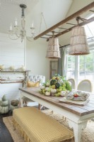 A seasonal display of gourds  adds a hint of color that offsets a palette of neutral tones, and radiates country vibes.