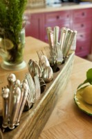 An old sugar mold makes a sweet utensil holder. 