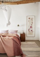 Modern country bedroom with large artwork on wall